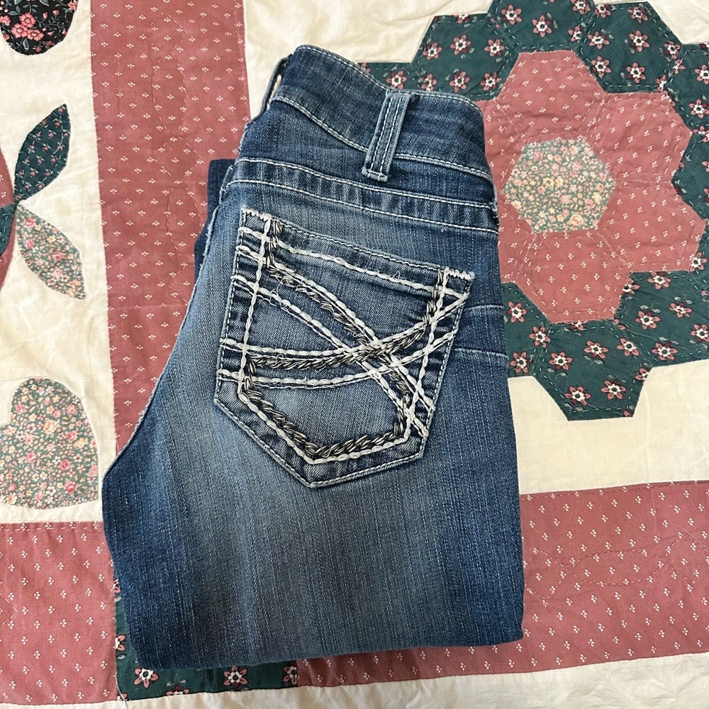 R.E.A.L. Mid Rise Stretch Entwined Boot Cut Jean 25 L